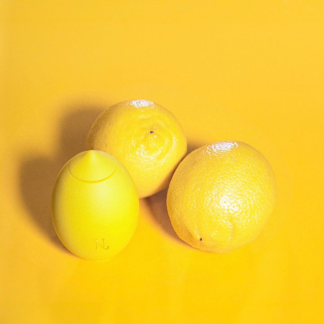 The Lem in hand — lemon clitoral massager